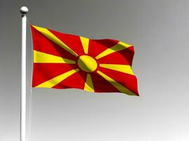 noorden Macedonië nationaal vlag golvend Aan grijs achtergrond foto