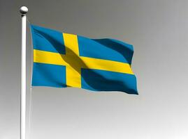 Zweden nationaal vlag golvend Aan grijs achtergrond foto