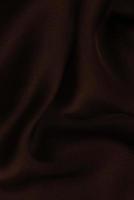 zijde of satijn luxe stof textuur kan gebruiken als abstracte achtergrond. bovenaanzicht.