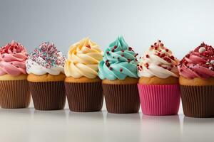 geïsoleerd genot kleurrijk verjaardag cupcakes uitgelijnd in een rij tegen een wit backdrop ai gegenereerd foto