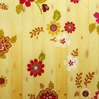 bloem wijnoogst van kleding stof Aan houten muur achtergrond. foto