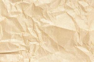 verfrommeld kraftpapier textuur achtergrond. licht goudbruine kleur foto