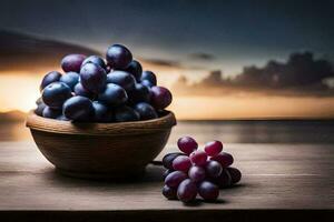 druiven in een kom Aan een tafel met zonsondergang in de achtergrond. ai-gegenereerd foto