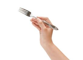 vrouw hand- Holding een zilver roestvrij vork detailopname foto geïsoleerd Aan wit achtergrond