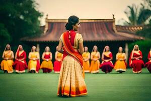 een vrouw in een sari is staand in voorkant van een groep van Dames. ai-gegenereerd foto