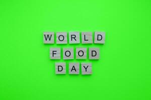 oktober 16, wereld voedsel dag, minimalistisch banier met de opschrift in houten brieven foto