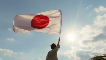 Mens Holding de vlag van Japan tegen blauw lucht met zonnestralen. ai gegenereerd. foto