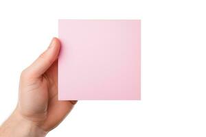 een menselijk hand- Holding een blanco vel van roze papier of kaart geïsoleerd Aan een wit achtergrond. ai gegenereerd foto