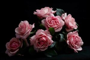 roze rozen op een zwarte achtergrond foto