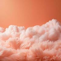 een katoen snoep oranje achtergrond met pluizig wolken foto