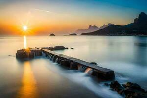 de zon stijgt over- de oceaan en rotsen. ai-gegenereerd foto