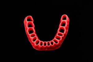 menselijk tandvlees zonder tanden model- medisch implantaat geïsoleerd Aan zwart achtergrond. gezond tanden, tandheelkundig zorg en orthodontisch concept. foto