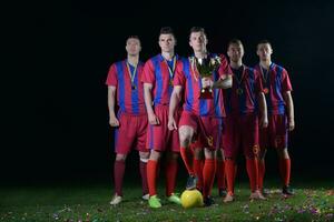 voetballers die de overwinning vieren foto