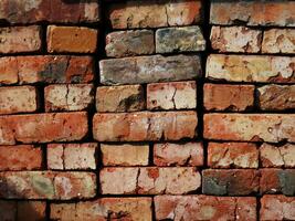 structuur van een helder oranje steen muur zonder cement foto