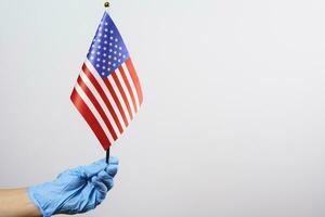 Amerikaans dokter Holding Verenigde Staten van Amerika nationaal vlag foto