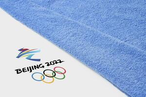 Beijing 2022 winter olympisch spellen en handdoek foto