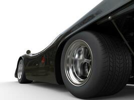 glimmend Jet zwart wijnoogst ras auto - achterzijde wiel detailopname schot foto