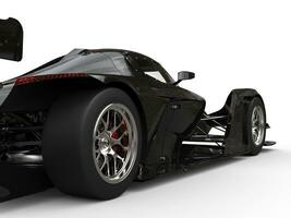 modern glimmend zwart super sport- ras auto - achterzijde wiel detailopname schot foto