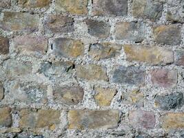 oud steen muur patroon dichtbij visie achtergrond, oude bakstenen oppervlakte foto