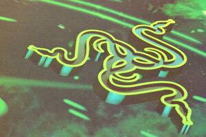 scheermes goliathus snelheid gaming groen muis stootkussen met logo van drie slangen tribal Aan donker achtergrond foto