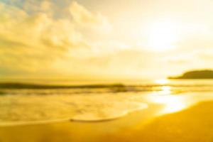 abstract vervagen strand zee bij zonsopgang of zonsondergang tijd voor achtergrond foto