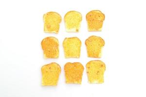 Gebakken krokant brood met boter en suiker geïsoleerd op een witte achtergrond foto