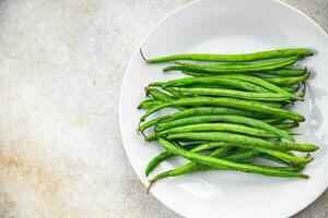 groen bonen rauw vers Boon peul aan het eten Koken eetpatroon maaltijd voedsel tussendoortje Aan de tafel kopiëren ruimte voedsel foto