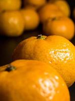 glanzende oppervlaktetextuur van versheid oranje fruit foto