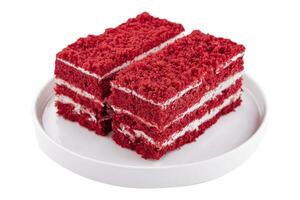 twee plakjes rood fluweel taart Aan bord foto
