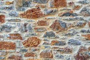 stenen muur hek rustieke textuur achtergrond close-up. foto