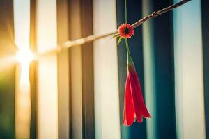 een rood bloem hangende van een draad. ai-gegenereerd foto