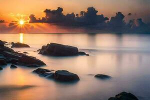 de zon stijgt over- de oceaan en rotsen. ai-gegenereerd foto