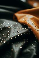een dichtbij omhoog van een zwart en oranje kleding stof met water druppels Aan het generatief ai foto