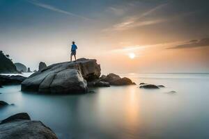 een Mens staand Aan een rots Bij de strand Bij zonsondergang. ai-gegenereerd foto