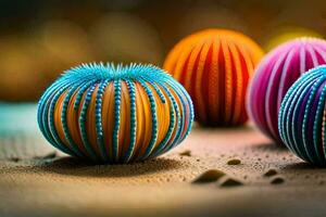 drie kleurrijk ballen van verschillend kleuren Aan een zanderig oppervlak. ai-gegenereerd foto