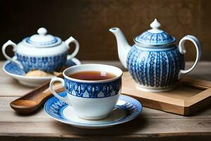 een blauw en wit thee pot en kop Aan een houten tafel. ai-gegenereerd foto