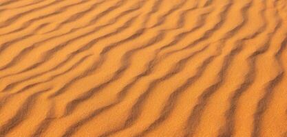 zand achtergrond panorama van de woestijn rimpels van zand geblazen door de wind foto
