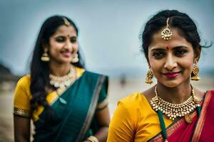 twee Dames in traditioneel sari's staand Aan de strand. ai-gegenereerd foto