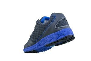 sneaker grijs met blauw zolen. sport schoenen Aan wit achtergrond foto