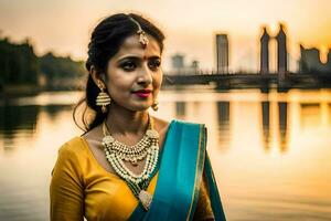 mooi Indisch vrouw in Saree poseren door water. ai-gegenereerd foto