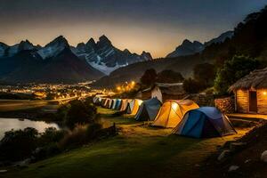 tenten zijn lit omhoog Bij nacht in voorkant van een berg bereik. ai-gegenereerd foto