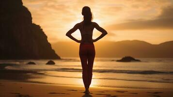 een vrouw in rood broek staand Aan de strand Bij zonsondergang. generatief ai foto