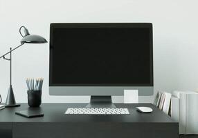 een werkkamer met een computer op de tafel foto