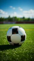 een voetbal bal tegen een pittoreske voetbal veld- achtergrond verticaal mobiel behang ai gegenereerd foto