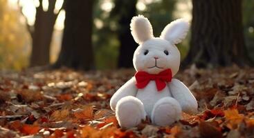 schattig konijn zittend Aan een blad, genieten van de herfst buitenshuis gegenereerd door ai foto