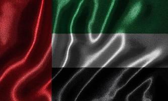 behang door de vlag van de arabische emiraten en wapperende vlag door stof. foto
