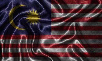 behang door vlag van Maleisië en wapperende vlag door stof. foto
