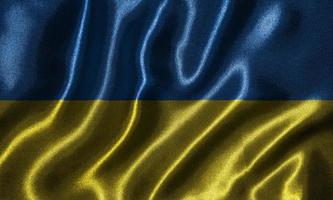 behang door de vlag van Oekraïne en wapperende vlag door stof. foto