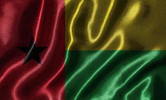 behang met vlag van guinea-bissau en wapperende vlag per stof.
