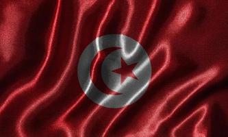 behang met vlag van Tunesië en wapperende vlag per stof. foto
